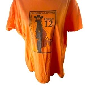 LAT Cotton Tee Women XL Orange Front Graphic of Woman and District12 State Names